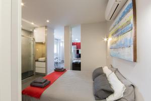 A bed or beds in a room at WindRose 1
