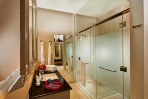 
a bathroom with a shower, sink, and toilet at Heritance Negombo in Negombo
