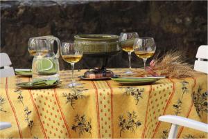 a table with three glasses of wine on it at Ferienhaus Gloecknerhaus in Michelstadt