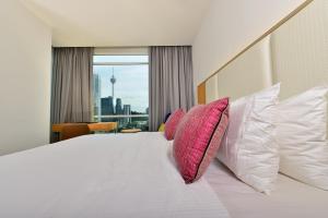Postel nebo postele na pokoji v ubytování Tamu Hotel & Suites Kuala Lumpur