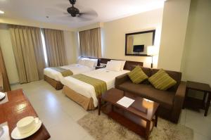 Ένα ή περισσότερα κρεβάτια σε δωμάτιο στο Azalea Residences Baguio