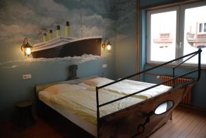 Postel nebo postele na pokoji v ubytování Hotel Champ Alsace
