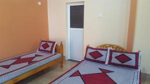 Postel nebo postele na pokoji v ubytování Tulip Guest Inn