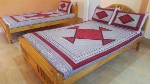 Postel nebo postele na pokoji v ubytování Tulip Guest Inn