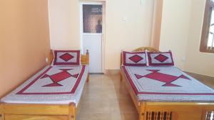 Postel nebo postele na pokoji v ubytování Tulip Guest Inn
