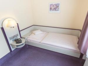 
Ein Bett oder Betten in einem Zimmer der Unterkunft Stadt-gut-Hotel Siegboot
