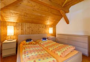 a bedroom with two beds and two night stands at X-Park Františkov in Jindřichov