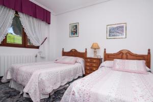 Un pat sau paturi într-o cameră la Villa Ruben