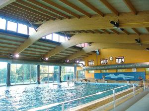 a large swimming pool with a large swimming pool at Campus Cerdanya in Puigcerdà