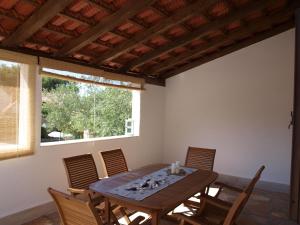 a dining room with a wooden table and chairs at Apartment Lux Star in Milna