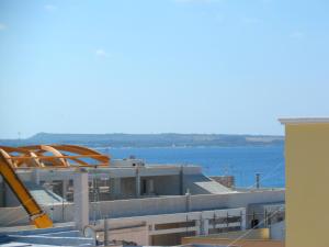 a large building with a view of the water at Gallipoli centro in Gallipoli