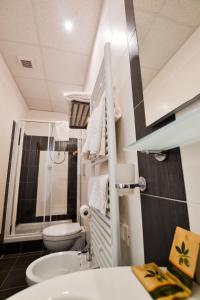 a bathroom with a white toilet and a sink at B&B AL VIALE in Foggia