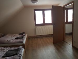 Voodi või voodid majutusasutuse Apartmány TAS toas