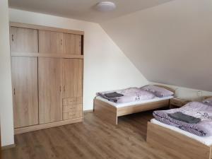 Voodi või voodid majutusasutuse Apartmány TAS toas