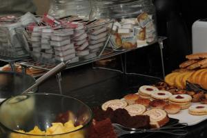a bunch of different types of pastries on a table at Real Caparica Hotel in Costa da Caparica