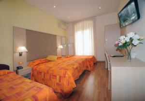 Postel nebo postele na pokoji v ubytování Hotel Alexander & Spa