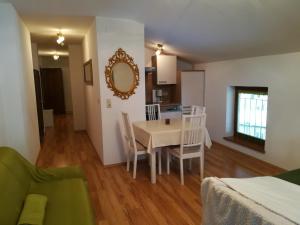 a kitchen and dining room with a table and chairs at Gästehaus Anna in Grossarl