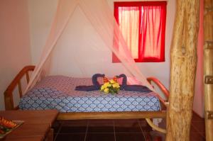 Gulta vai gultas numurā naktsmītnē Casa bungalow Ital-Tico
