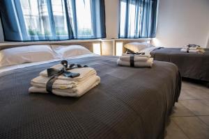 Ένα ή περισσότερα κρεβάτια σε δωμάτιο στο Vecchia Ognina