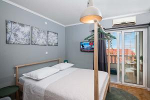 Posteľ alebo postele v izbe v ubytovaní Villa Makarana Apartments