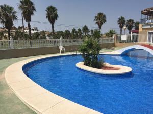 a large blue swimming pool in a resort at Appartement Pinogrande in Rojales