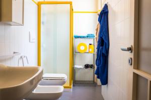 a bathroom with a toilet and a sink at Amarcord casa vacanze in Alberobello