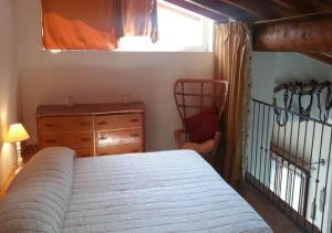 a bedroom with a bed and a dresser and a window at La Davana Parma in Salsomaggiore Terme +36 photos
