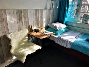 Rúm í herbergi á Bed & Breakfast Hotel Zandvoort