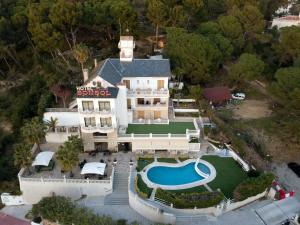 an aerial view of a mansion with a swimming pool at Hotel Bonsol ADULTS ONLY in Lloret de Mar