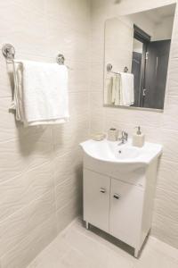 Kylpyhuone majoituspaikassa Victoria Duplex Apartament
