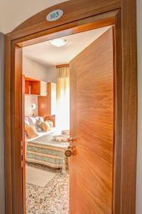 Postel nebo postele na pokoji v ubytování Hotel Oregon
