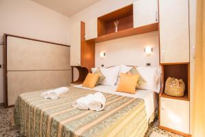 Postel nebo postele na pokoji v ubytování Hotel Oregon