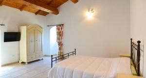 Ένα ή περισσότερα κρεβάτια σε δωμάτιο στο Torre Bruno