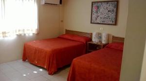 Voodi või voodid majutusasutuse Hotel Carrizal Spa toas