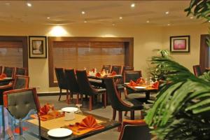 A restaurant or other place to eat at Galaxy Amman Hotel