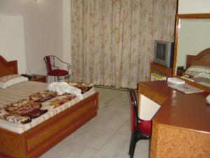Postel nebo postele na pokoji v ubytování Pamposh Guest House, Gurgaon