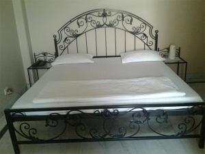 Postel nebo postele na pokoji v ubytování Pamposh Guest House, Gurgaon