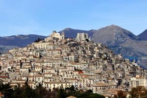 a town on top of a hill with houses at Hotel La Falconara in Castrovillari