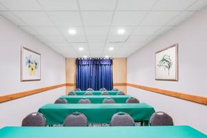 a conference room with green tables and chairs at Wingate by Wyndham - York in York