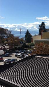 a parking lot with cars parked in a parking lot at Day&Night in Ohrid