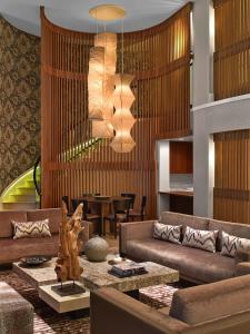 a living room with a couch and a table at Nobu Hotel at Caesars Palace in Las Vegas