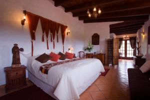 Postel nebo postele na pokoji v ubytování Hacienda La Moreda Hotel Boutique & Spa