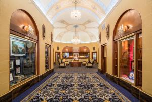 a hallway of a building with a large ceiling at Marines' Memorial Club & Hotel Union Square in San Francisco