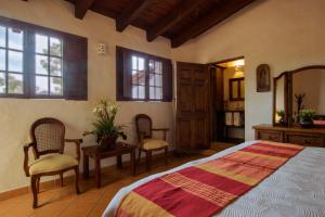 Postel nebo postele na pokoji v ubytování Hacienda La Moreda Hotel Boutique & Spa