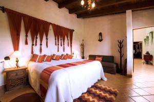 Postel nebo postele na pokoji v ubytování Hacienda La Moreda Hotel Boutique & Spa