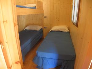 Postel nebo postele na pokoji v ubytování Campeggio Valle Gesso