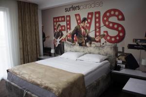 Postel nebo postele na pokoji v ubytování Garni Hotel Hollywoodland Wellness & Aquapark