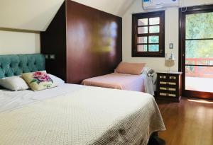 Llit o llits en una habitació de Hotel Aeropuerto Ezeiza Casa de MR