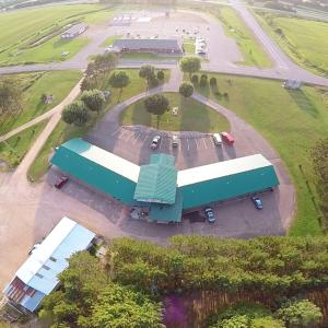 an overhead view of a building with a parking lot at Country Villa Motel in Tilden