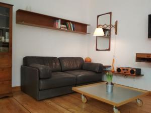 a living room with a couch and a coffee table at Neustadt - Paradies in Dresden
